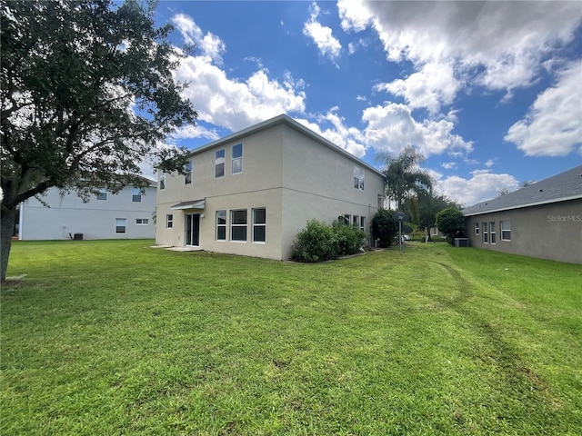 back of house with a yard