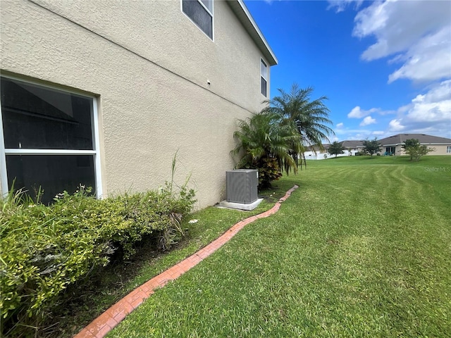 view of yard featuring central AC