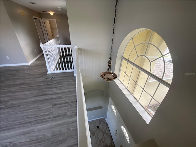 stairs with hardwood / wood-style flooring