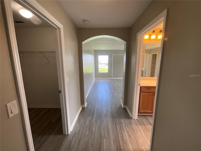 hall with hardwood / wood-style flooring