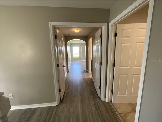 corridor featuring dark hardwood / wood-style flooring