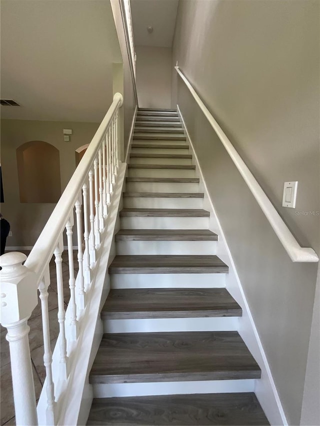 stairway featuring hardwood / wood-style floors