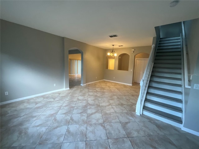 empty room with a chandelier