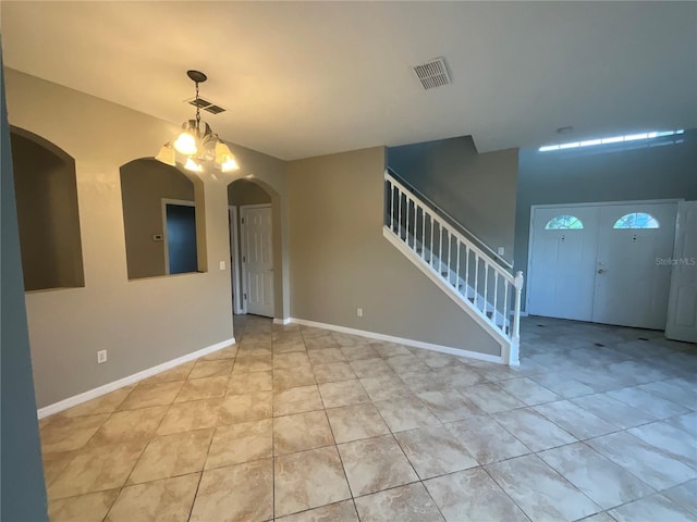 interior space featuring a notable chandelier