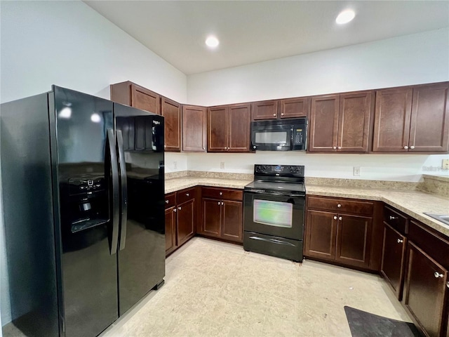 kitchen with dark brown cabinetry and black appliances