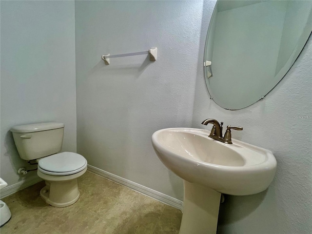 bathroom featuring toilet