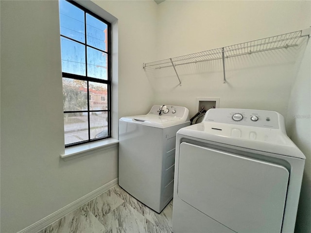 laundry room with washing machine and dryer