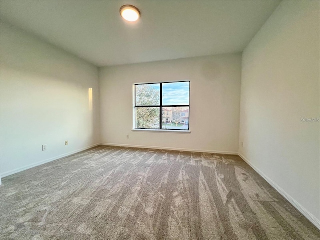 empty room featuring light colored carpet