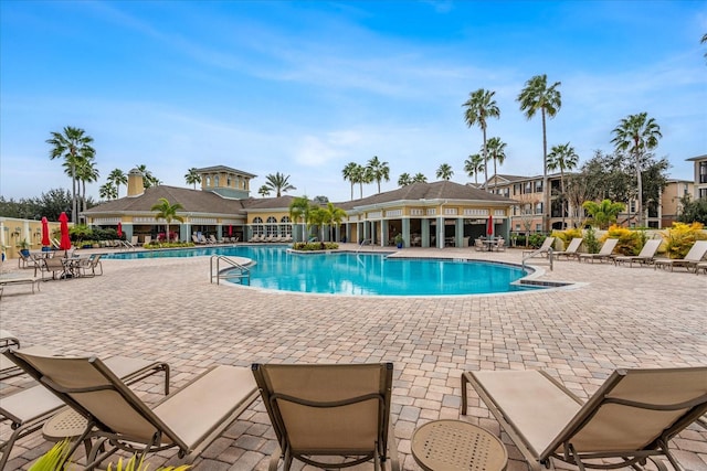 view of swimming pool featuring a patio area