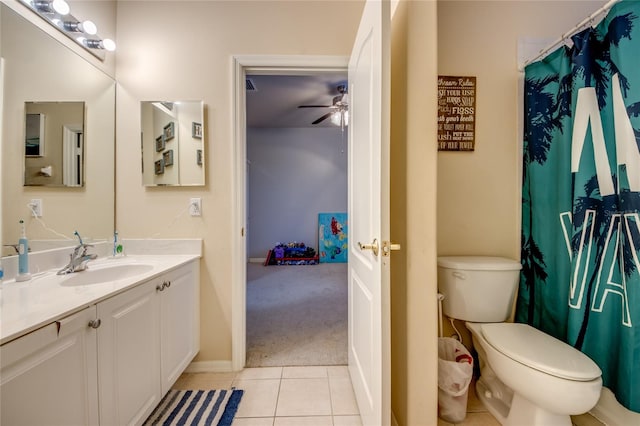 bathroom featuring tile patterned floors, ceiling fan, vanity, and toilet