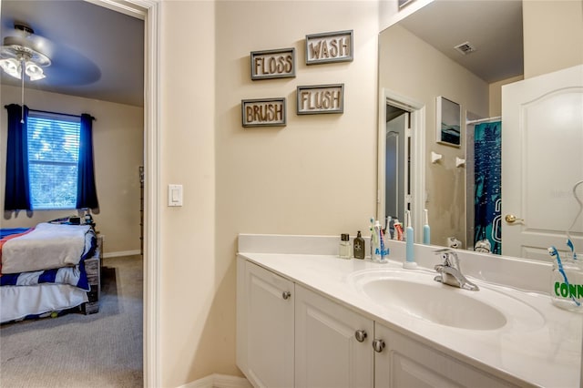 bathroom featuring ceiling fan and vanity