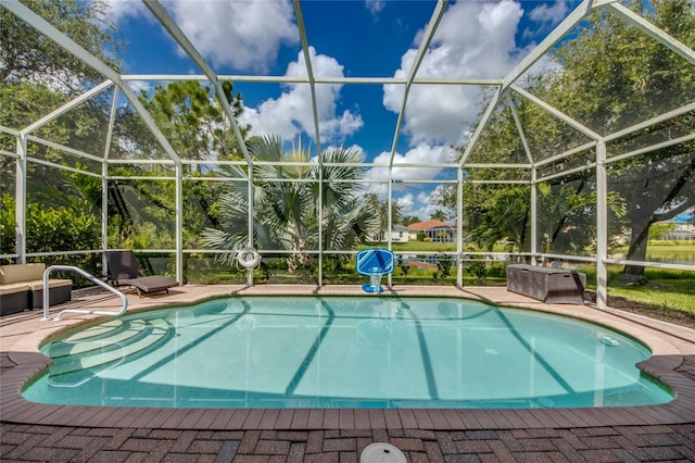 view of pool featuring a patio and a lanai