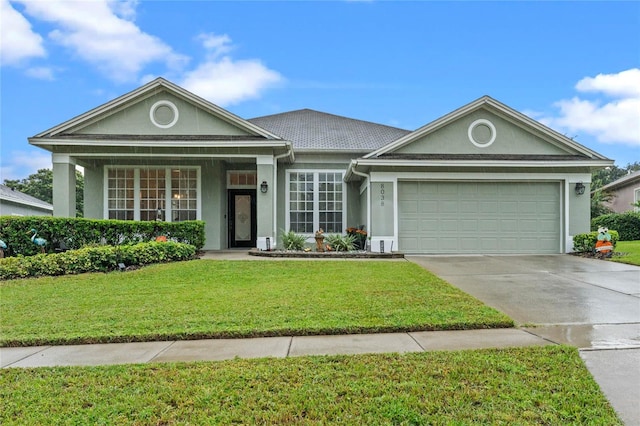 view of front facade featuring a front lawn and a garage