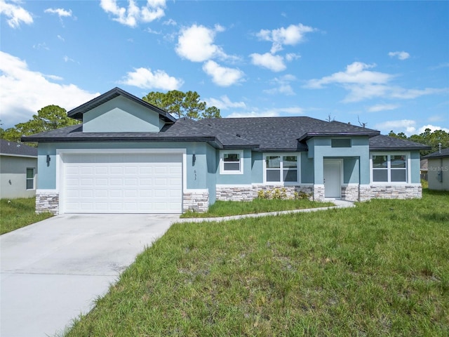 view of front of house with a front lawn and a garage