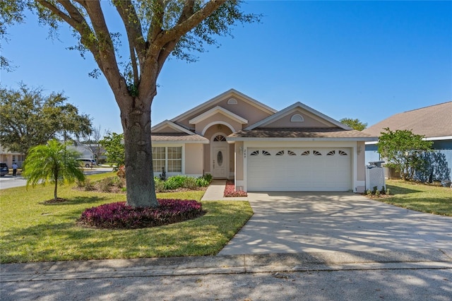 single story home featuring a garage and a front lawn