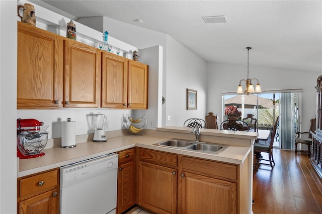 kitchen featuring dishwasher, sink, dark wood-type flooring, kitchen peninsula, and lofted ceiling