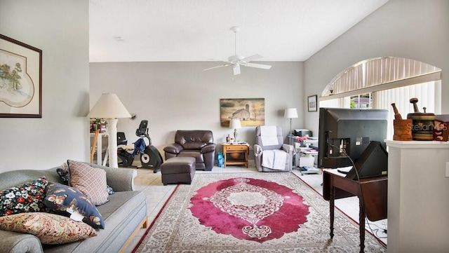 living room with ceiling fan and tile patterned floors