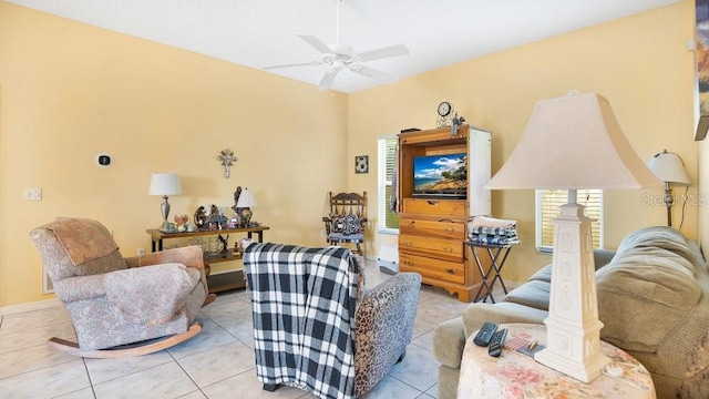 living room with ceiling fan, light tile patterned floors, and plenty of natural light