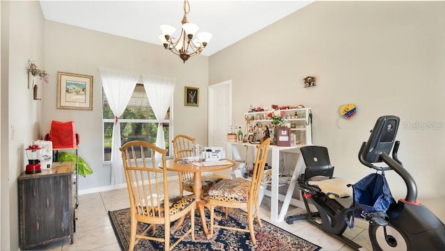 tiled dining room with a chandelier