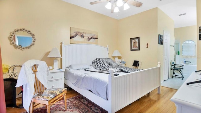 bedroom with wood-type flooring and ceiling fan