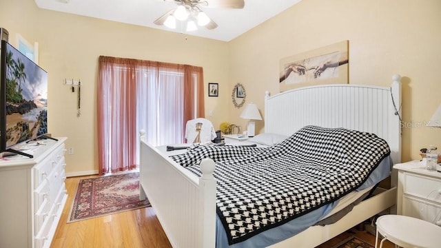 bedroom featuring wood-type flooring and ceiling fan