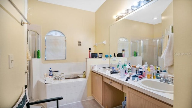 bathroom with vanity, shower with separate bathtub, and tile patterned flooring