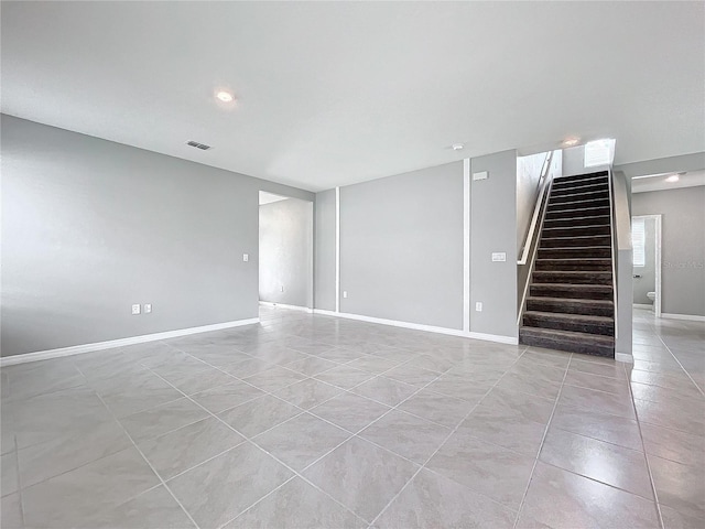 spare room with light tile patterned flooring