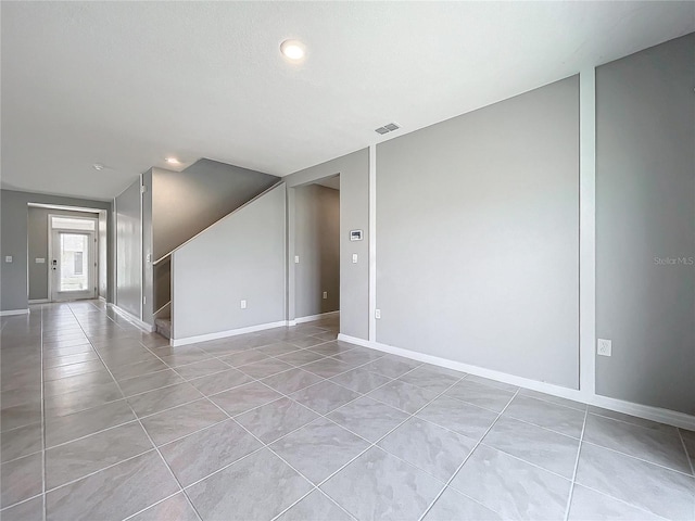 empty room featuring light tile patterned flooring