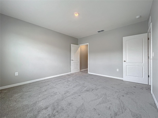 spare room featuring carpet floors