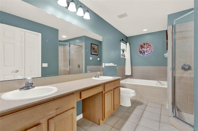 full bathroom with vanity, shower with separate bathtub, toilet, and tile patterned flooring