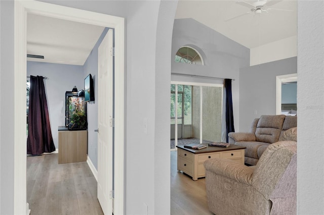 interior space with vaulted ceiling, light hardwood / wood-style floors, and ceiling fan