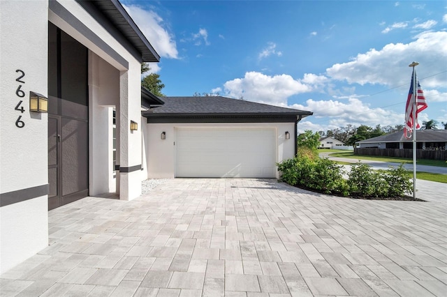 view of property exterior featuring a garage