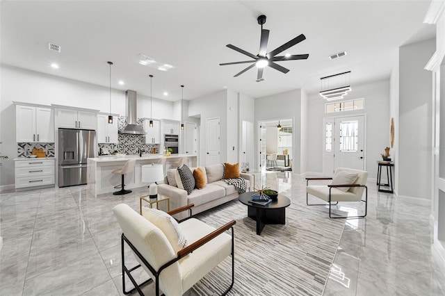 living room featuring ceiling fan