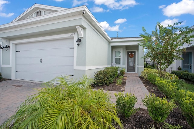 single story home featuring a garage