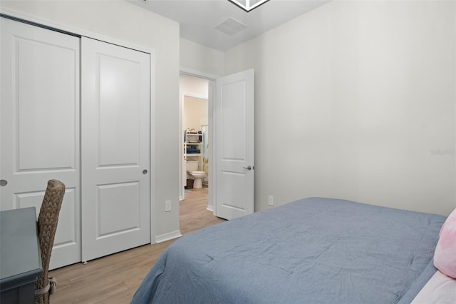 bedroom with a closet and light wood-type flooring