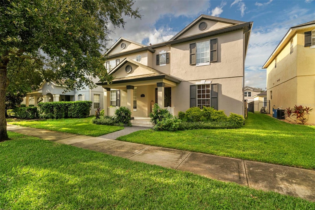 view of front property with a front yard and central air condition unit