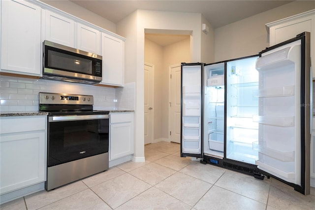 kitchen with stainless steel appliances and white cabinetry