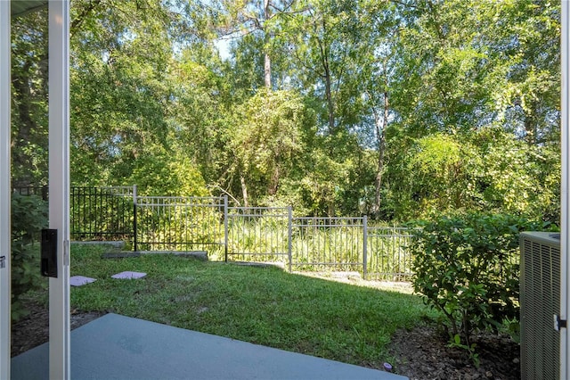 view of yard featuring a patio and central air condition unit