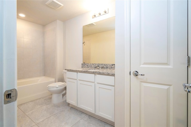 full bathroom with tiled shower / bath, vanity, toilet, and tile patterned floors