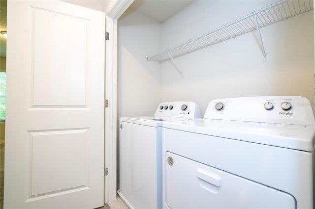 washroom featuring washer and clothes dryer