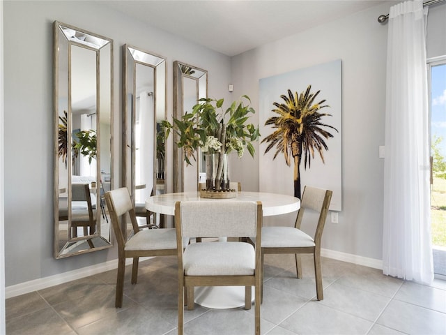 dining area with light tile patterned floors and a wealth of natural light