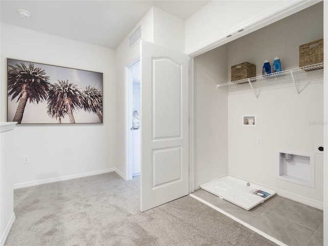 washroom with washer hookup and light colored carpet