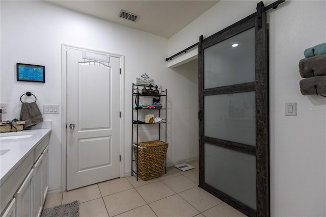 bathroom with tile patterned flooring and vanity