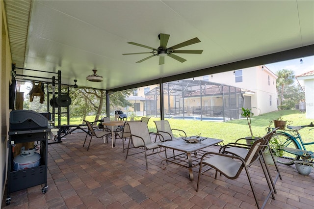 view of patio with a lanai and ceiling fan