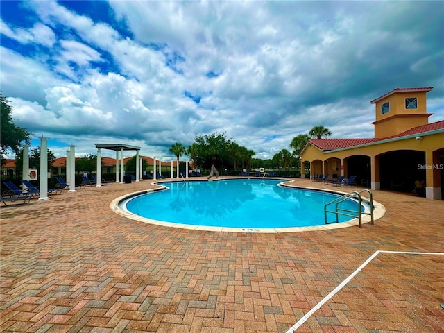 community pool with a patio area