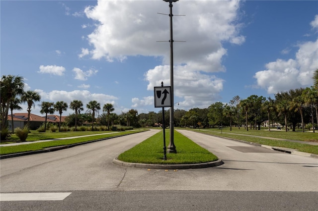 view of road featuring sidewalks and curbs