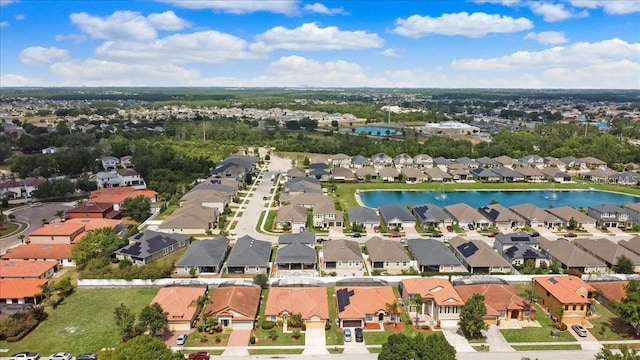 bird's eye view featuring a residential view and a water view