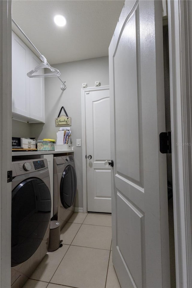 washroom with washer and dryer, recessed lighting, and light tile patterned floors