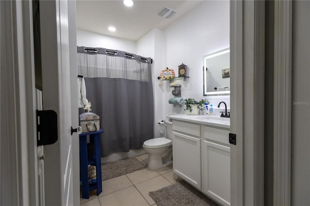 bathroom with vanity, shower / bathtub combination with curtain, visible vents, tile patterned floors, and toilet