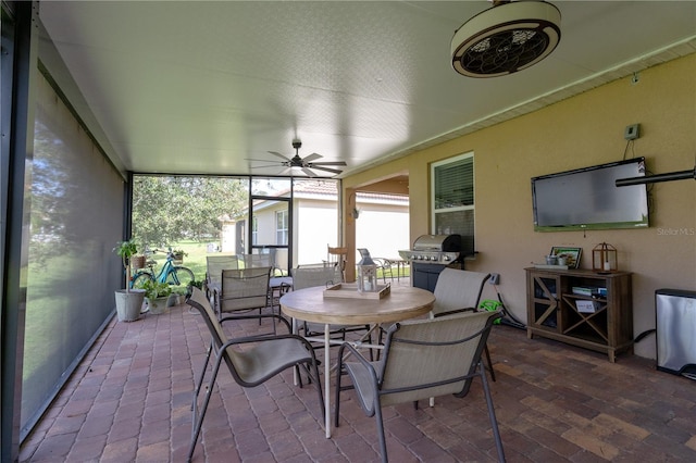 sunroom / solarium with ceiling fan